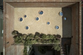 An aerial view of the work 'Uketamo' (2024) by Adeline de Monseignat, which is an exterior installation of nine mounds peeking through a bed of pebbles. Anomie Publishing